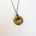 Tiger’s Eye Donut Pendant on Black Cord