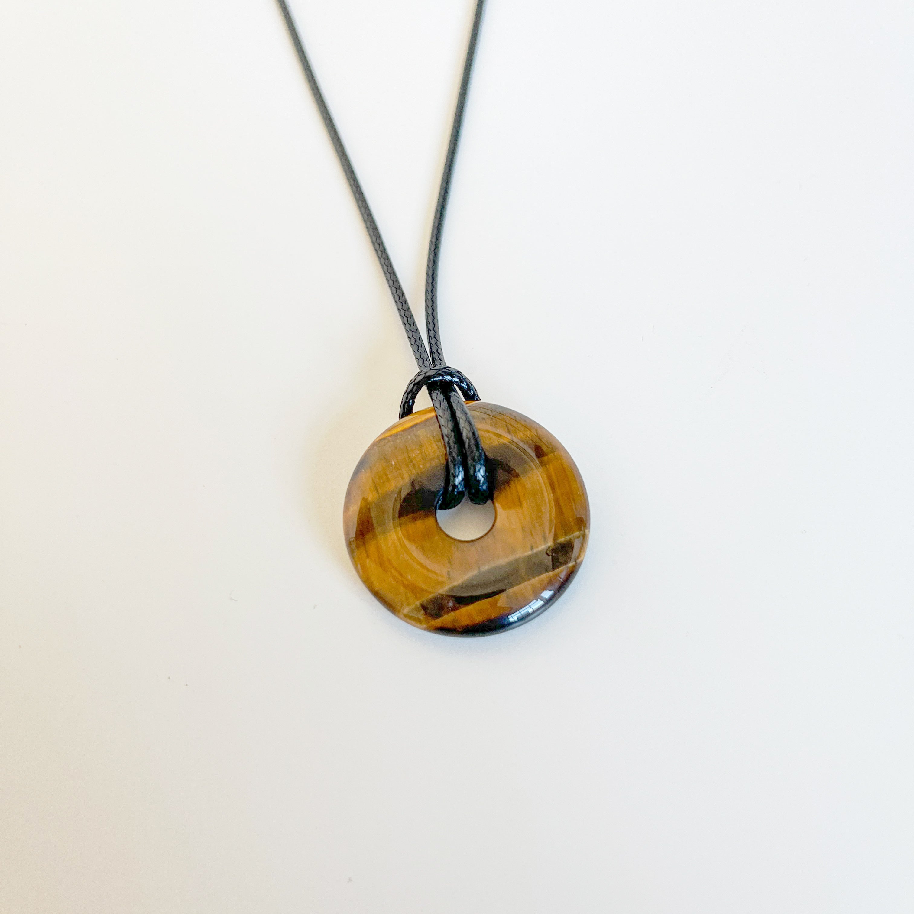 Tiger’s Eye Donut Pendant on Black Cord