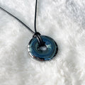 Hematite Donut Pendant on Black Cord